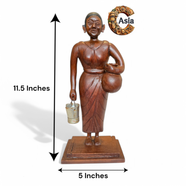 Vintage wooden village woman figurine with dimensions labeled 11.5 inches tall and 5 inches wide