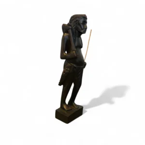 Side view of handcrafted wooden statue of tribal hunter with axe and pouch – Crafts Asia