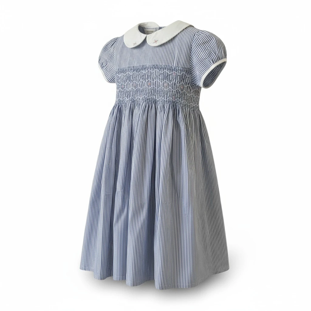 Handcrafted blue smocked cotton dress displayed on mannequin – Crafts Asia